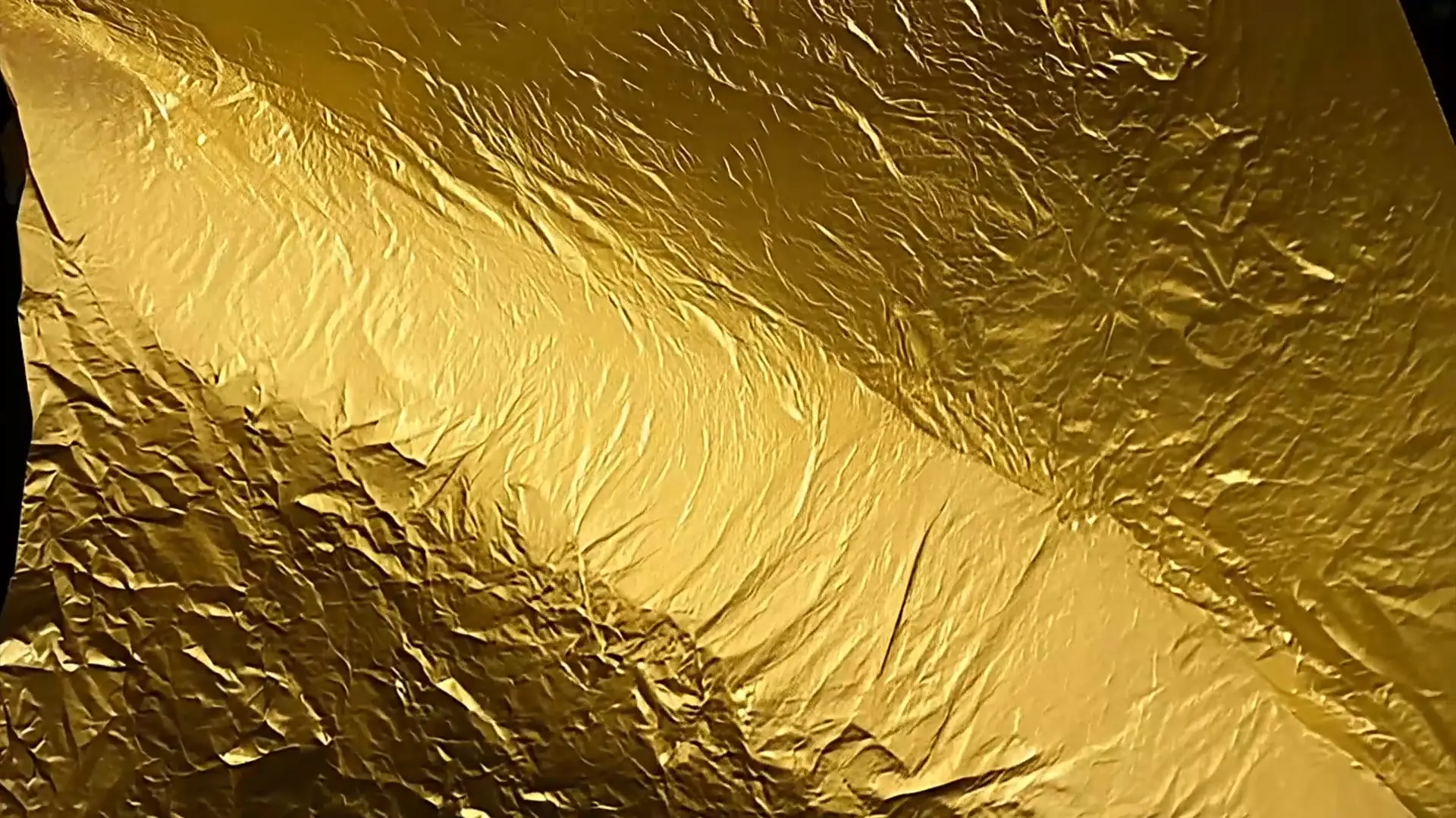 Textured Gold Crinkled Foil Background for Logo Animation